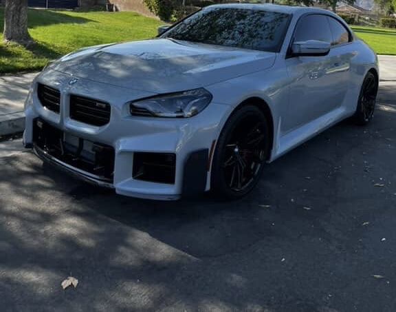 White BMW M2 parked in the sun